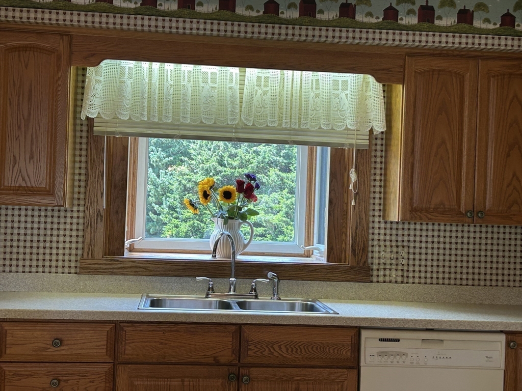 273 Main Street Acushnet, MA 02743 - Photo 17 of 37 a bathroom with a sink a mirror and window