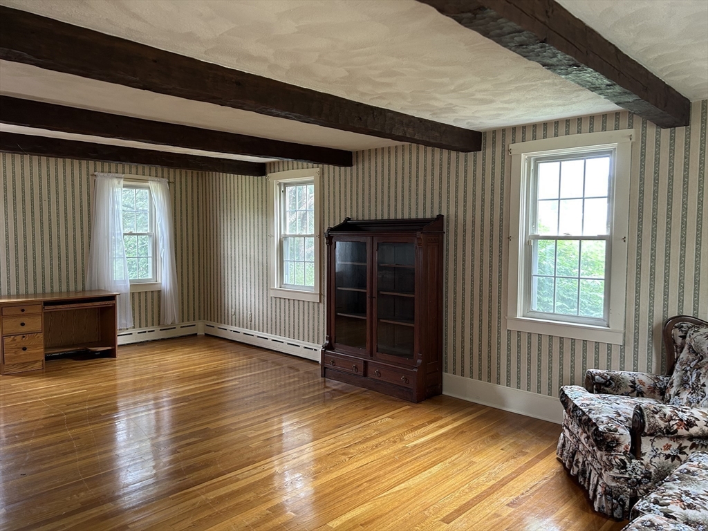 273 Main Street Acushnet, MA 02743 - Photo 10 of 37 an empty room with windows wooden floor and windows