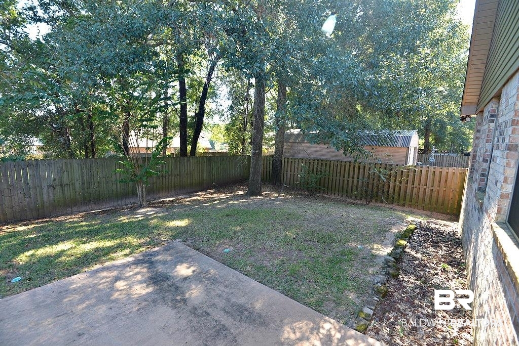 11201 Herschel Loop Daphne, AL 36526 - Photo 26 of 32 View of yard featuring a patio