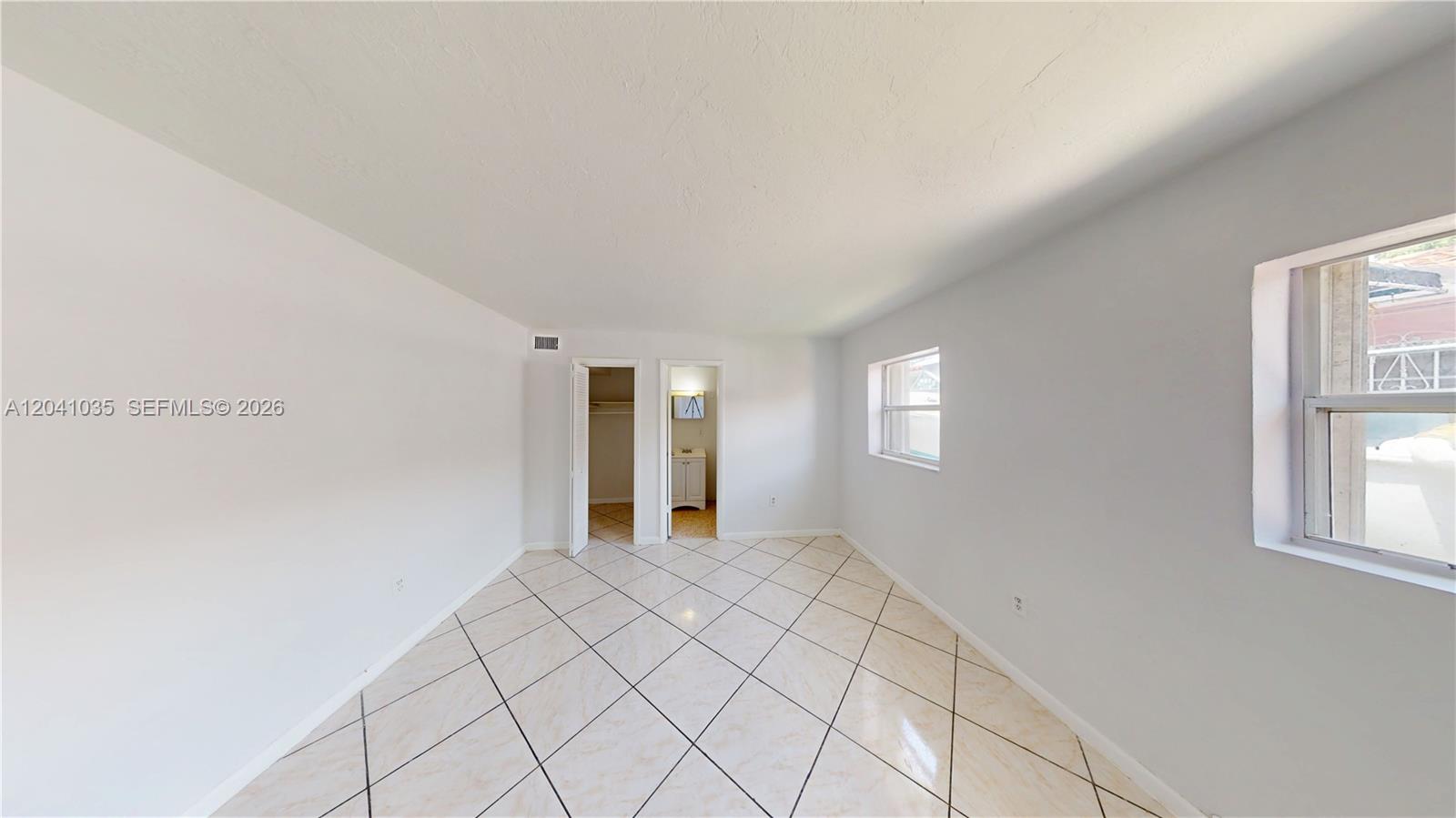 6811 Southwest 16th Street Miami, FL 33144 - Photo 12 of 21 a view of an empty room and window