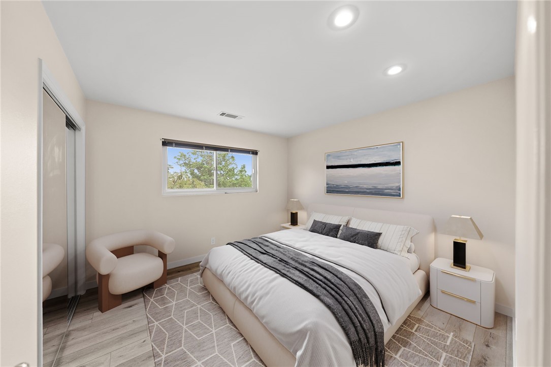 665 Norwynn Lane Fallbrook, CA 92028 - Photo 23 of 51 a bedroom with a large bed and a couch