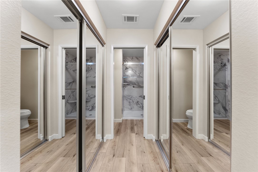 665 Norwynn Lane Fallbrook, CA 92028 - Photo 29 of 51 a bathroom with a glass door shower and a sink
