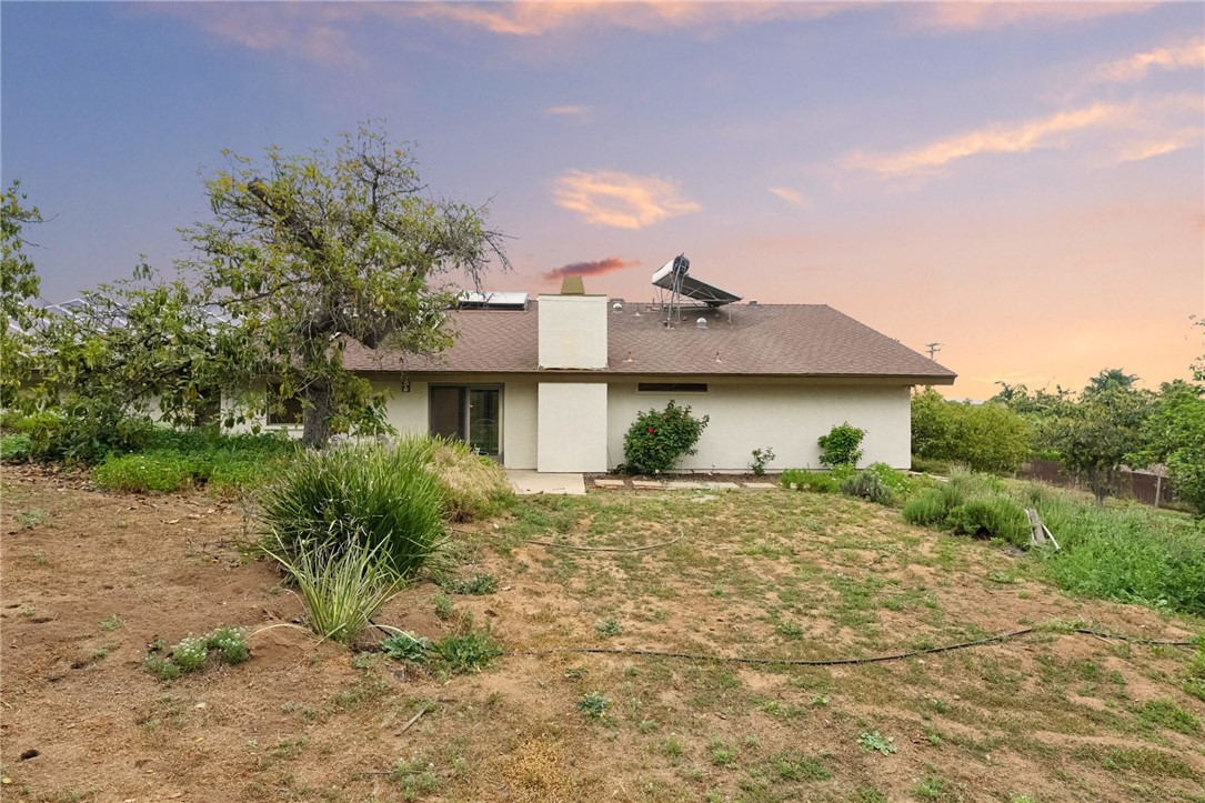 665 Norwynn Lane Fallbrook, CA 92028 - Photo 35 of 51 a front view of a house with a yard and garage
