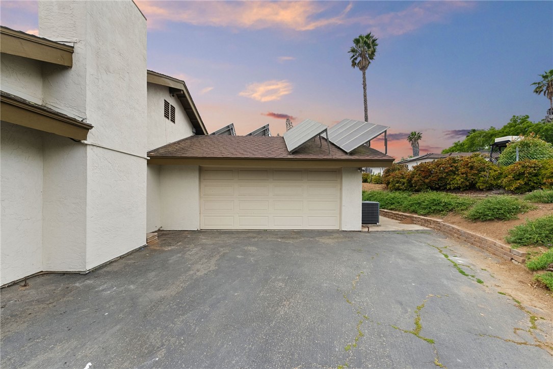 665 Norwynn Lane Fallbrook, CA 92028 - Photo 39 of 51 a front view of a house with a yard and garage