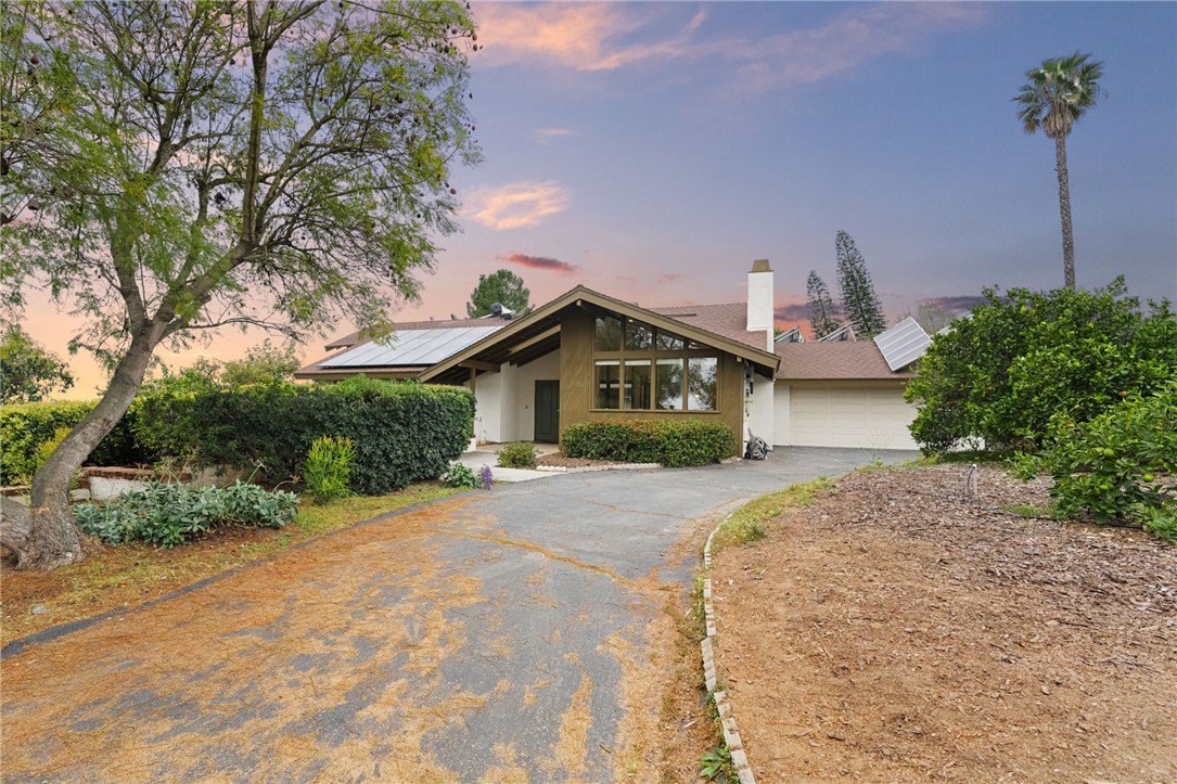 665 Norwynn Lane Fallbrook, CA 92028 - Photo 40 of 51 a front view of a house with a yard and garage