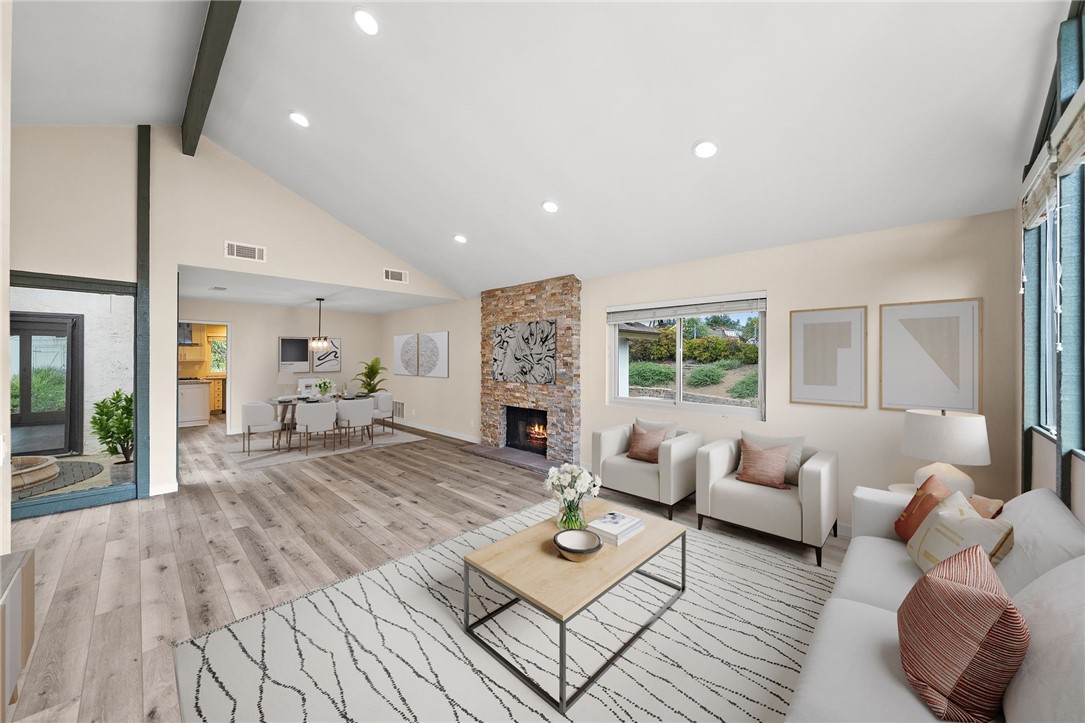 665 Norwynn Lane Fallbrook, CA 92028 - Photo 4 of 51 a living room with furniture and a fireplace