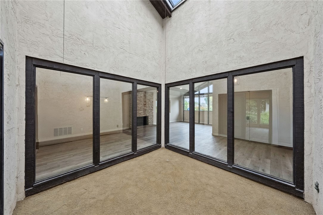 665 Norwynn Lane Fallbrook, CA 92028 - Photo 10 of 51 a view of an empty room with sliding glass door