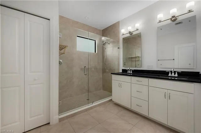a bathroom with a shower and a sink