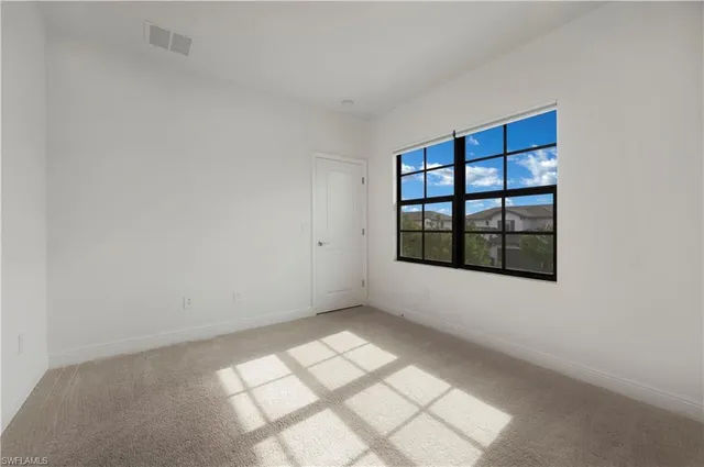 an empty room with windows