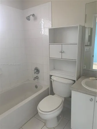 a view of a swimming pool with an outdoor seating