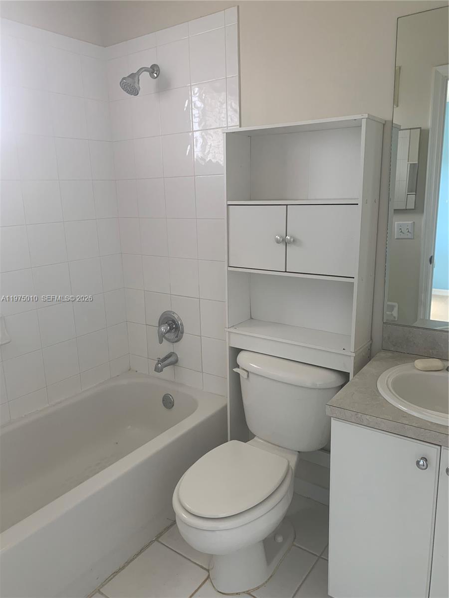 2211 Southeast 23rd Road, Unit 2211 Homestead, FL 33035 - Photo 19 of 39 a bathroom with a toilet and a bathtub