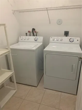 a view of a street with a cars parked in front of it