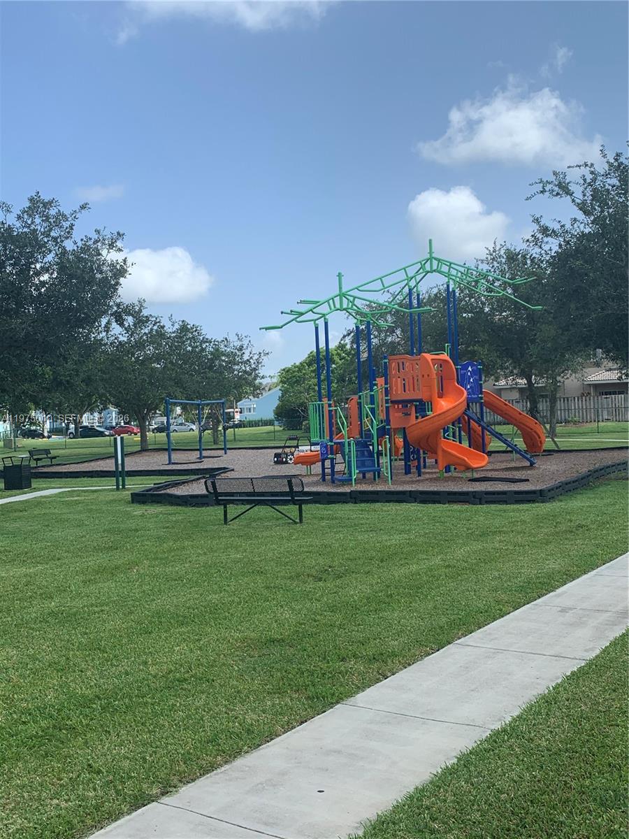 2211 Southeast 23rd Road, Unit 2211 Homestead, FL 33035 - Photo 30 of 39 a view of a park with large trees