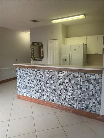 a bathroom with a toilet and a bathtub