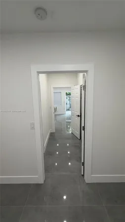 a view of hallway with livingroom