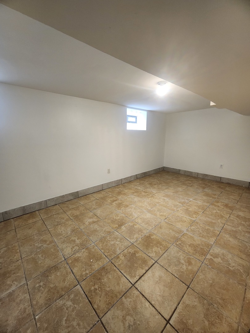 2017 Foster Street, Unit 1 Evanston, IL 60201 - Photo 13 of 21 an empty room with a empty space and a window