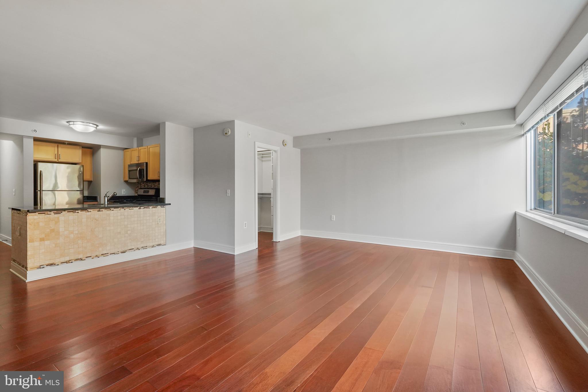 800 4th Street Southwest, Unit N111 Washington, DC 20024 - Photo 14 of 27 a view of a kitchen with wooden floor and a kitchen