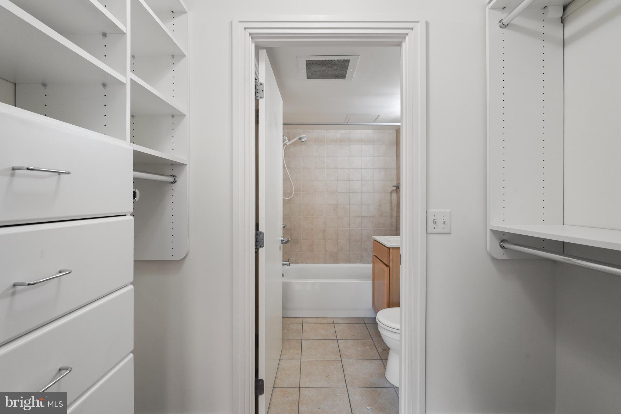 800 4th Street Southwest, Unit N111 Washington, DC 20024 - Photo 17 of 27 a bathroom with a bathtub and a toilet