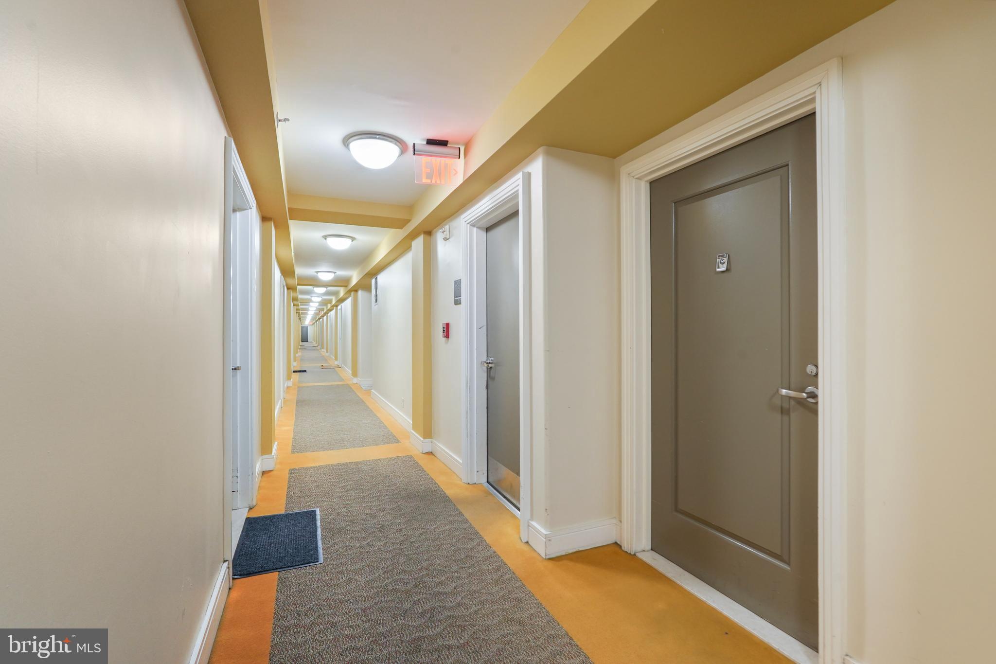 800 4th Street Southwest, Unit N111 Washington, DC 20024 - Photo 2 of 27 a view of a hallway with wooden floor and staircase