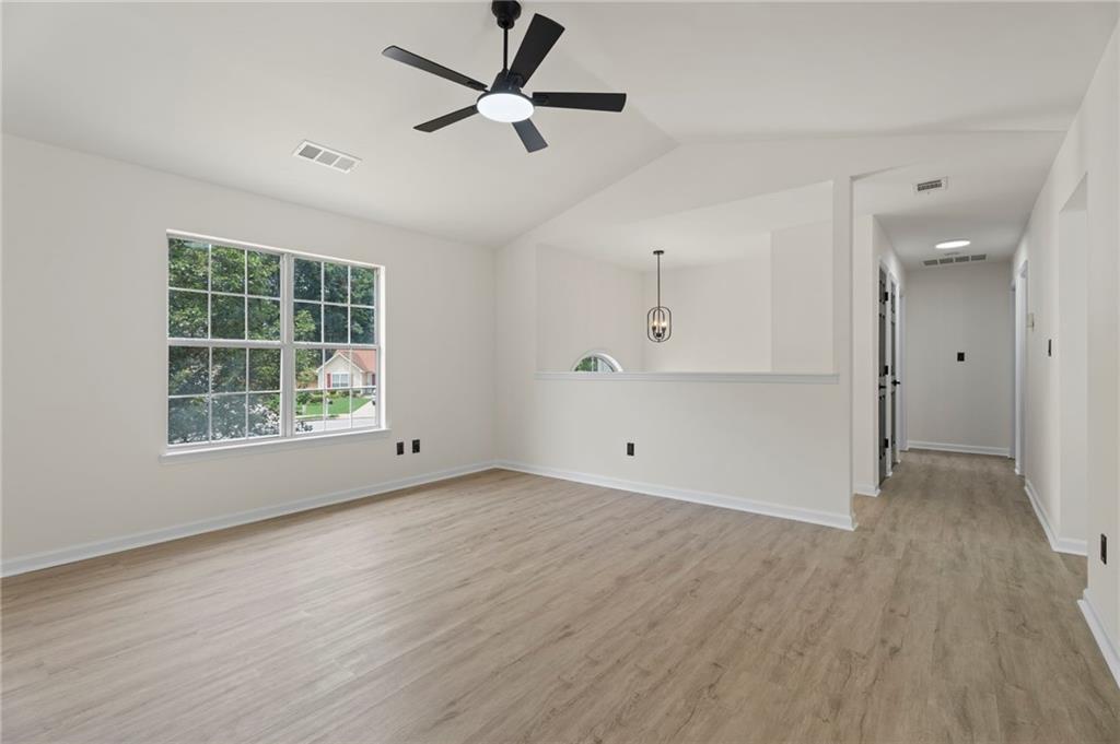 3602 Bristol Overlook Rex, GA 30273 - Photo 9 of 37 an empty room with wooden floor and windows