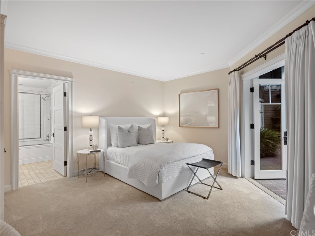 3 Stickley Drive Laguna Beach, CA 92651 - Photo 12 of 39 a bedroom with a bed and a lamp with window