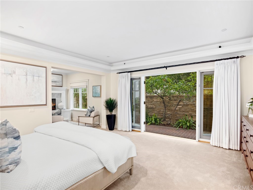 3 Stickley Drive Laguna Beach, CA 92651 - Photo 13 of 39 a bedroom with a large bed and a large window