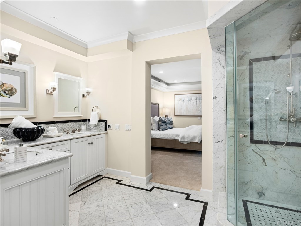 3 Stickley Drive Laguna Beach, CA 92651 - Photo 14 of 39 a en suite bathroom with a granite countertop sink mirror and shower