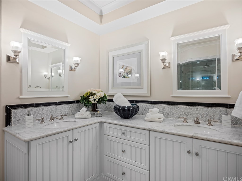 3 Stickley Drive Laguna Beach, CA 92651 - Photo 16 of 39 a bathroom with a sink and a mirror