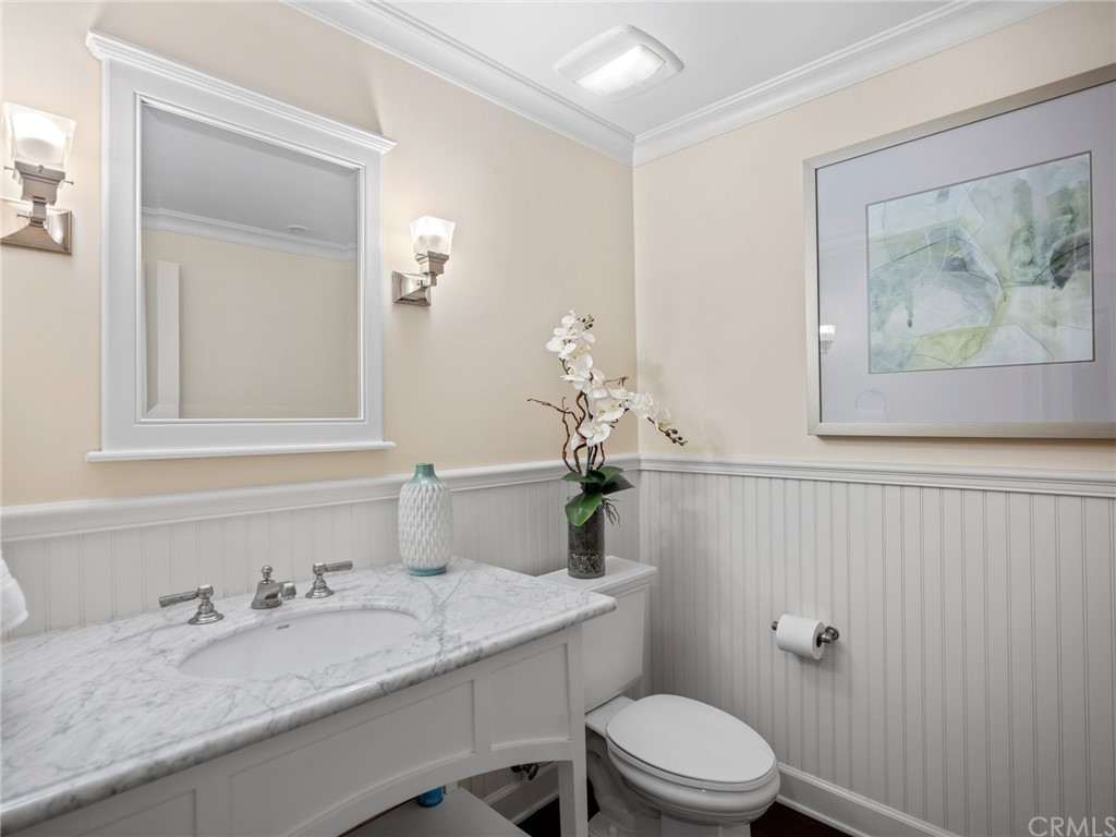 3 Stickley Drive Laguna Beach, CA 92651 - Photo 19 of 39 a bathroom with a granite countertop toilet a sink and mirror