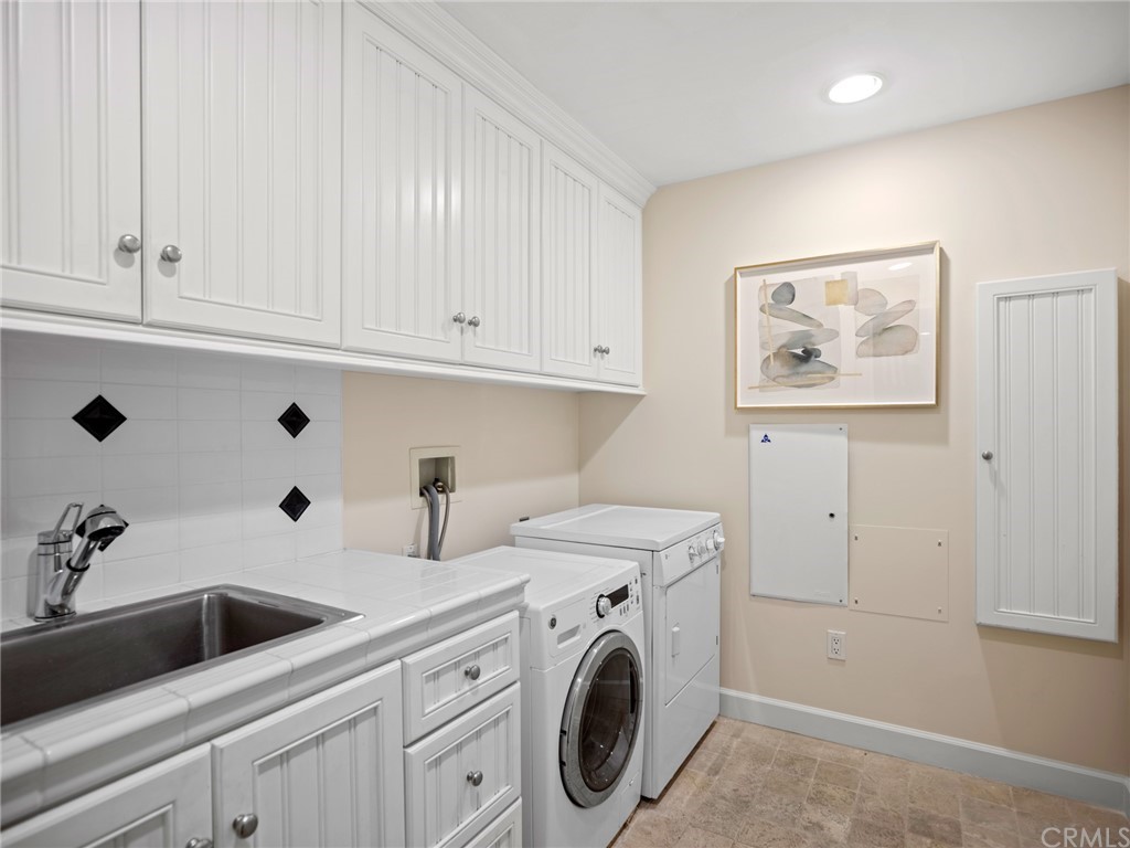 3 Stickley Drive Laguna Beach, CA 92651 - Photo 22 of 39 a view of cabinets and washer dryer