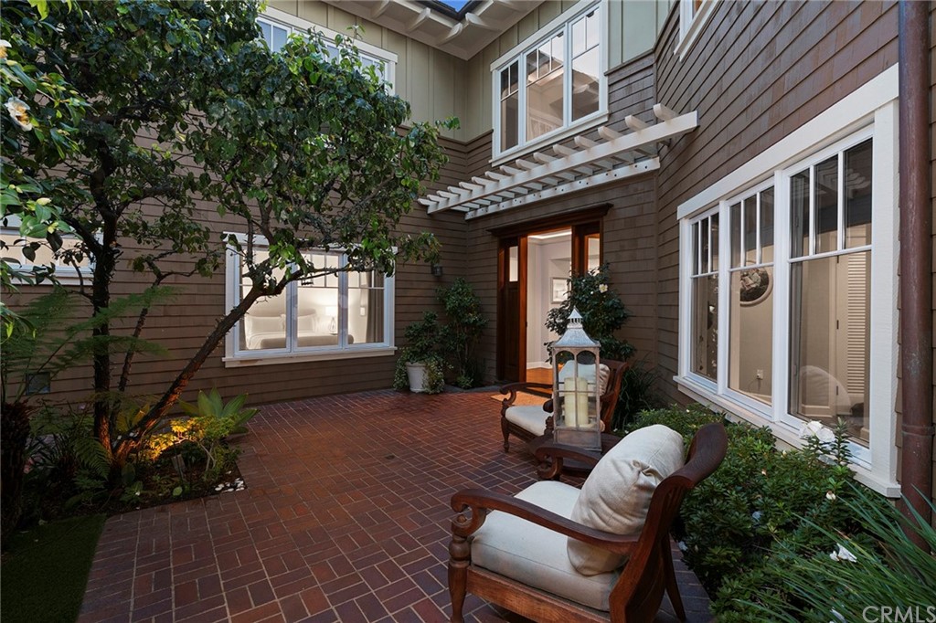 3 Stickley Drive Laguna Beach, CA 92651 - Photo 27 of 39 a view of a patio with couches table and chairs and potted plants