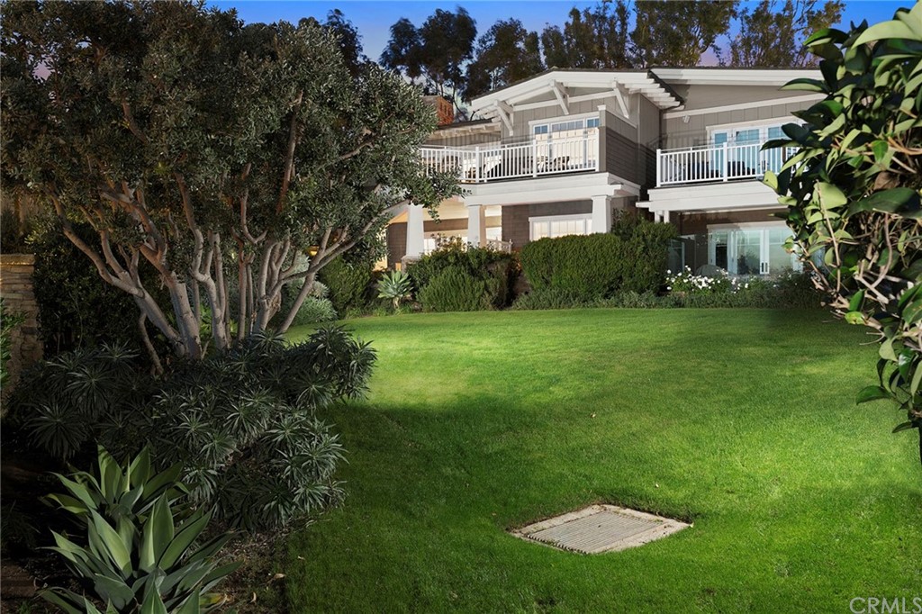 3 Stickley Drive Laguna Beach, CA 92651 - Photo 30 of 39 a view of a white house with a yard and sitting area