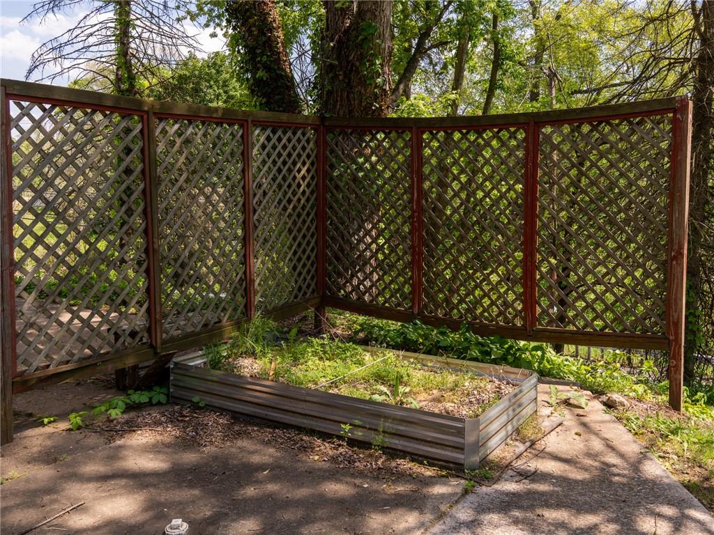 128 Clover Drive Monaca, PA 15061 - Photo 17 of 19 a view of a yard with wooden fence