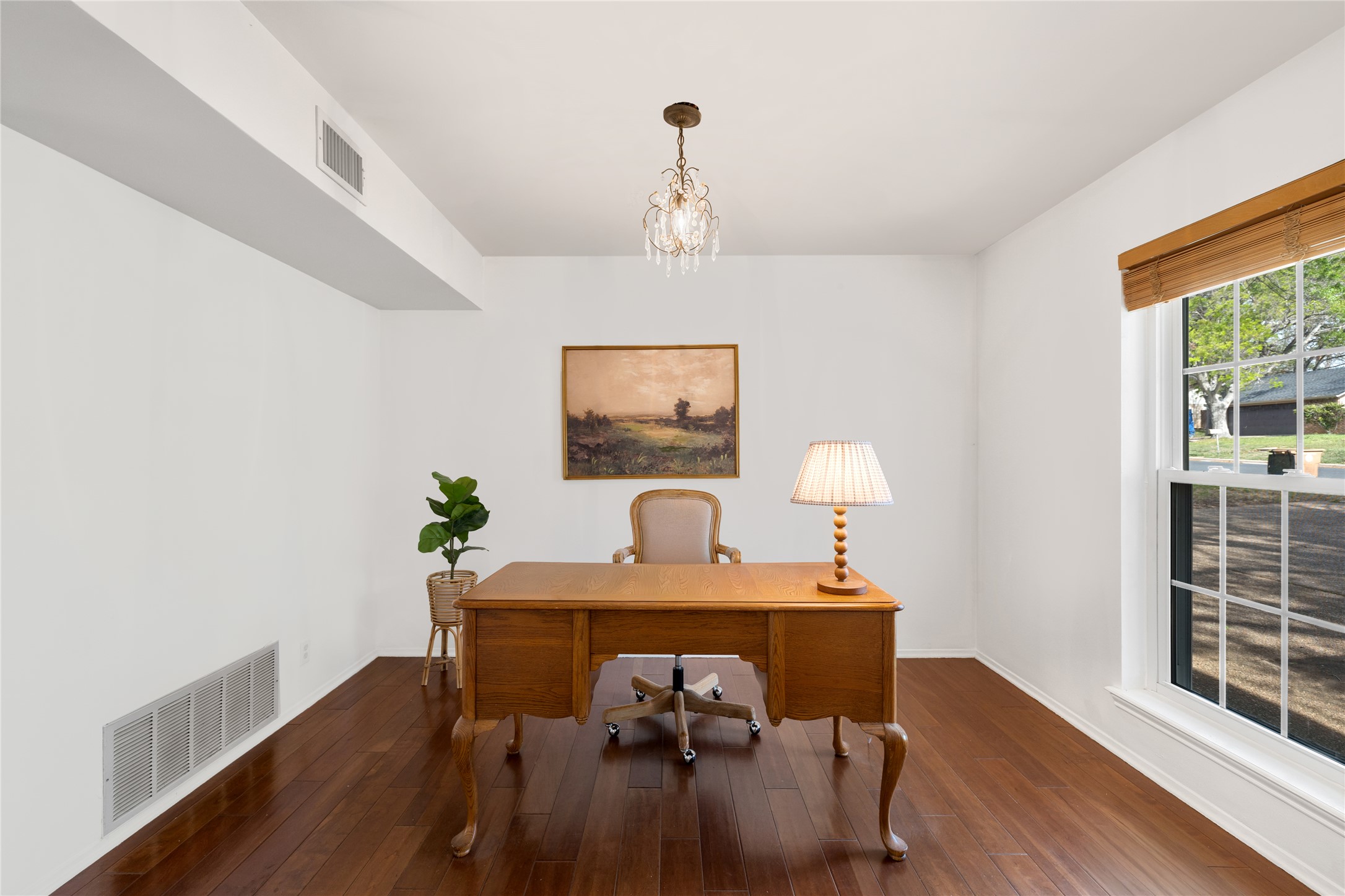 2403 Comburg Castle Way Austin, TX 78748 - Photo 13 of 40 Home office featuring dark wood-type flooring and suspended lighting
