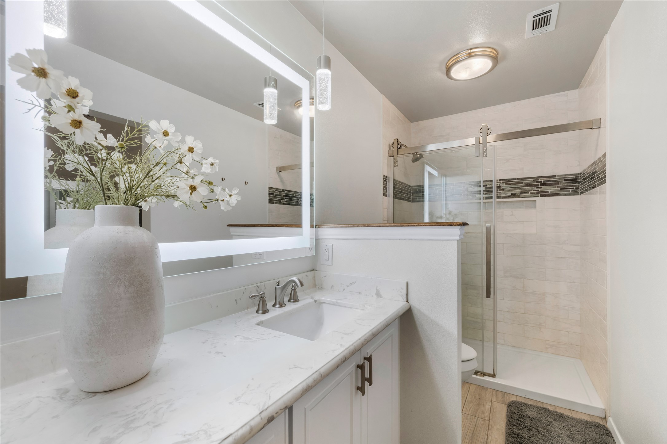 2403 Comburg Castle Way Austin, TX 78748 - Photo 25 of 40 Bathroom with vanity and a shower stall