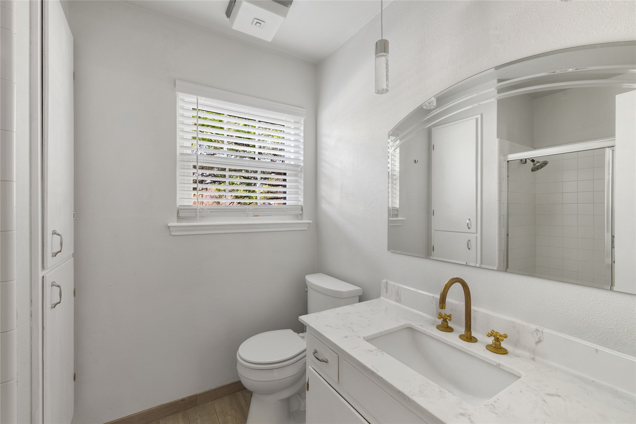 2403 Comburg Castle Way Austin, TX 78748 - Photo 30 of 40 Full bathroom featuring vanity, tiled shower, and wood finished floors