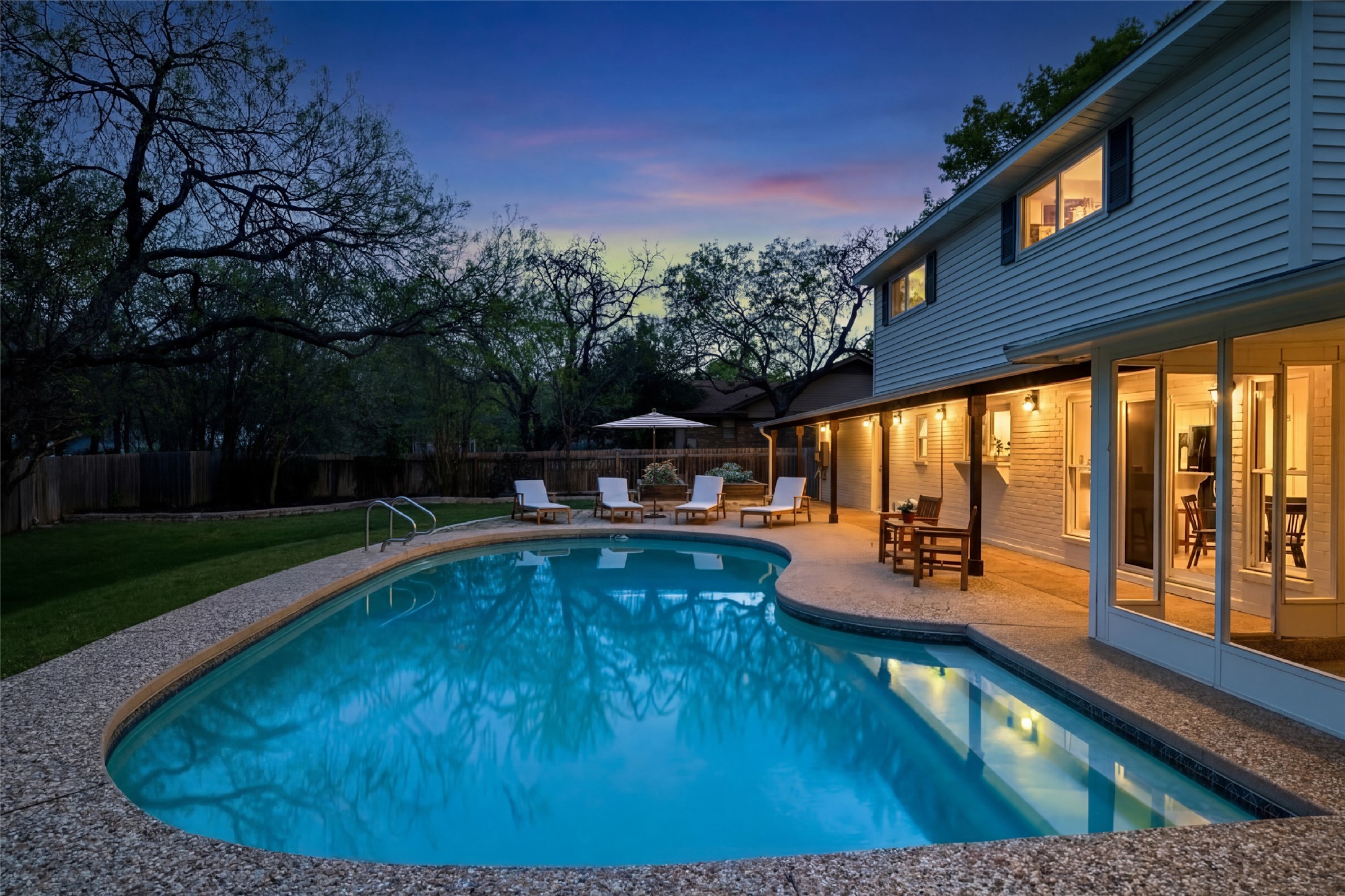 2403 Comburg Castle Way Austin, TX 78748 - Photo 32 of 40 Pool at dusk featuring a fenced backyard and a patio area