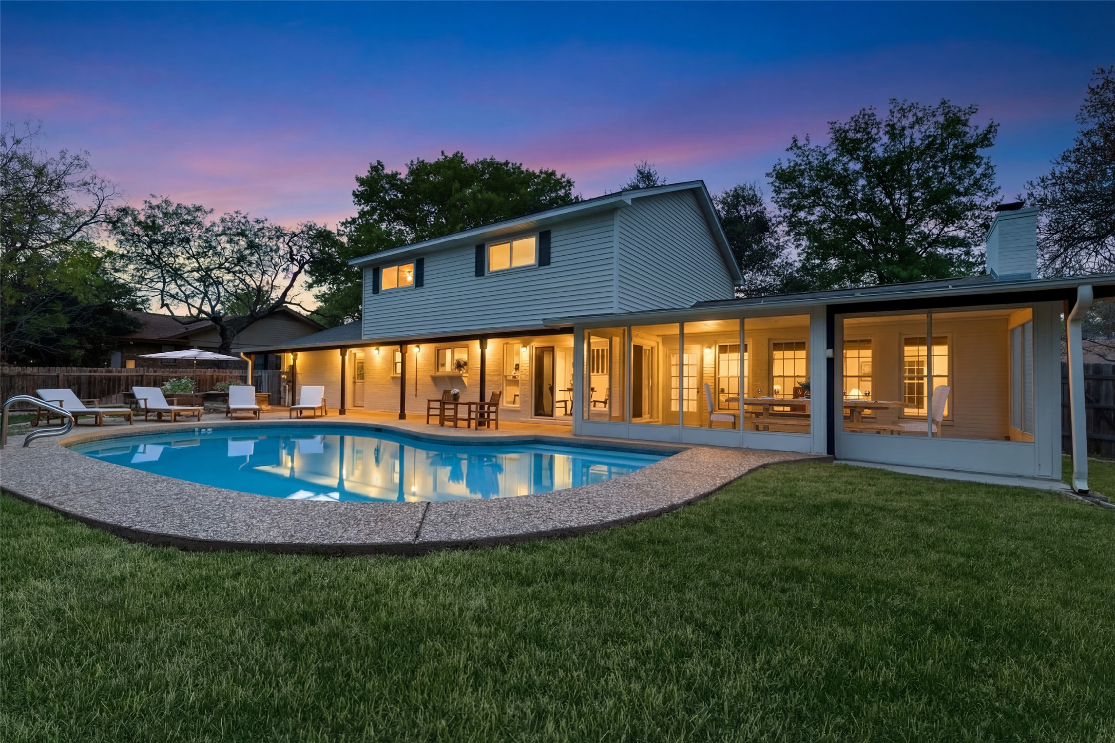 2403 Comburg Castle Way Austin, TX 78748 - Photo 34 of 40 Rear view of property featuring a patio area and a chimney