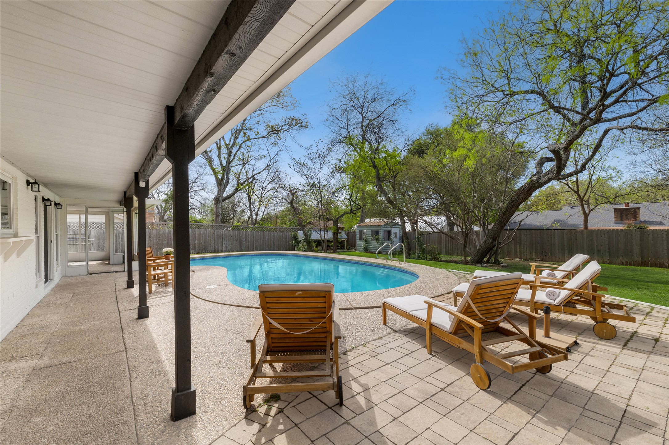 2403 Comburg Castle Way Austin, TX 78748 - Photo 35 of 40 View of pool with patio surround, a fenced backyard, and an outdoor structure