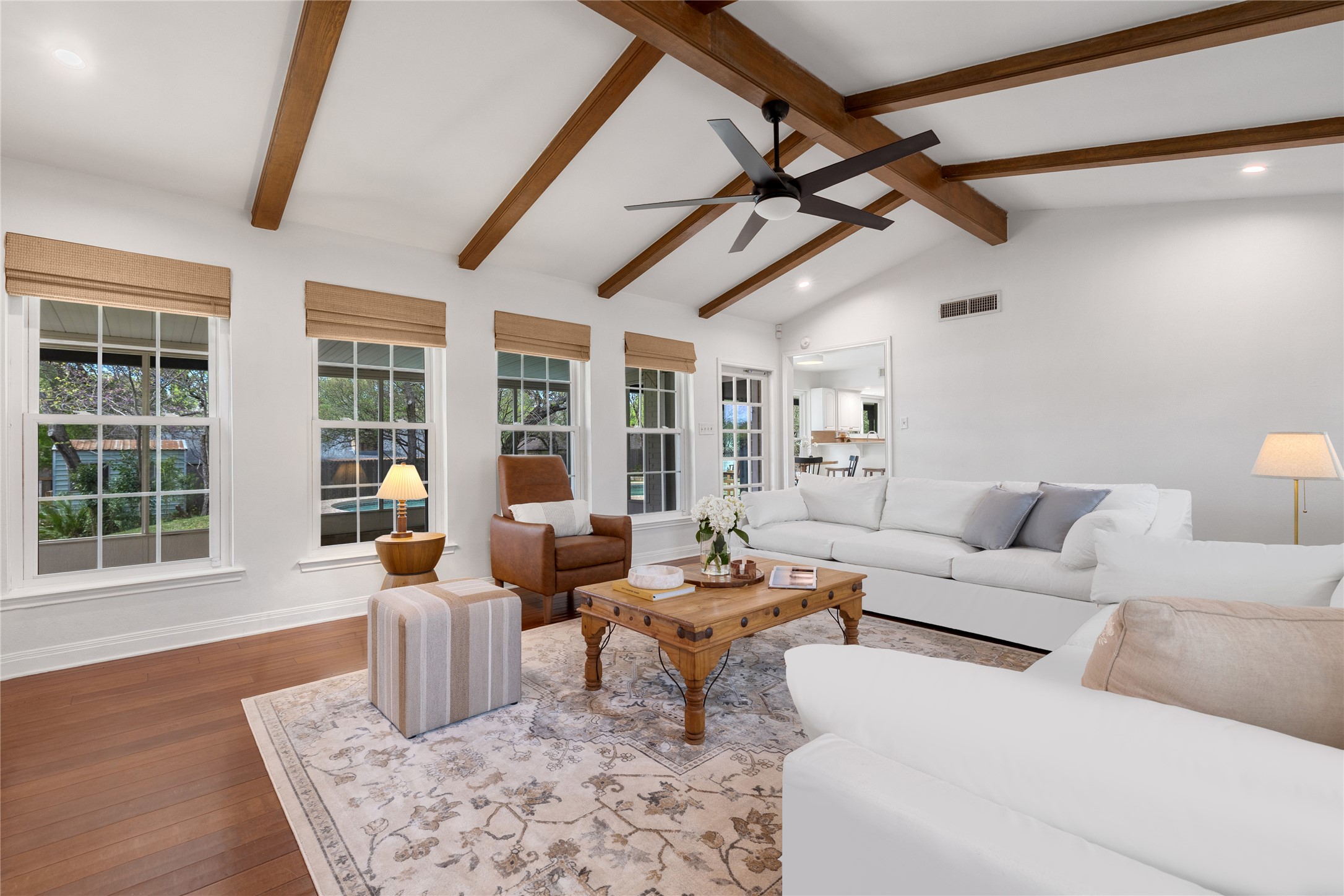 2403 Comburg Castle Way Austin, TX 78748 - Photo 10 of 40 Living room with hardwood / wood-style floors, recessed lighting, plenty of natural light, and ceiling fan