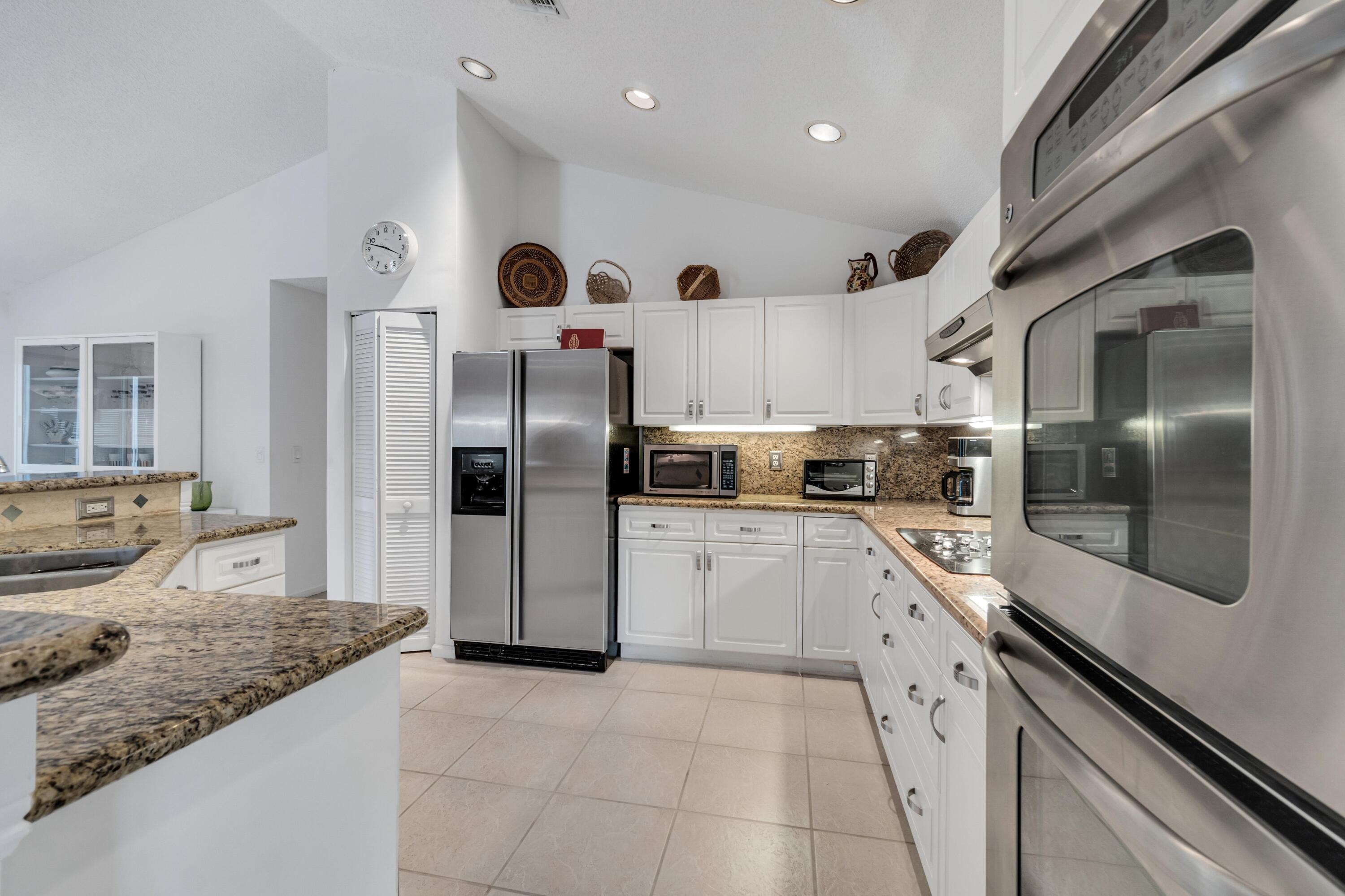 7746 La Corniche Circle Boca Raton, FL 33433 - Photo 12 of 44 Lots of cabinetry!