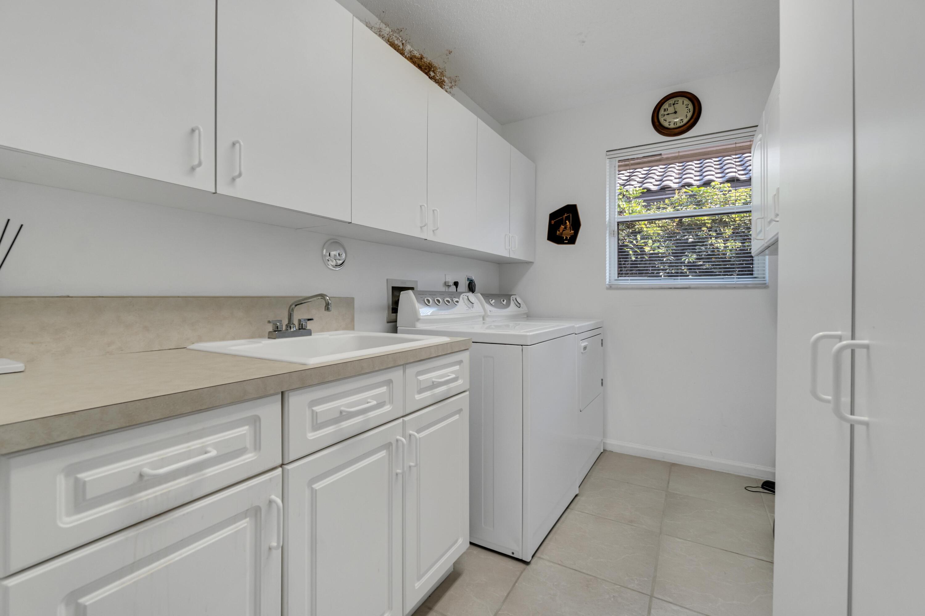 7746 La Corniche Circle Boca Raton, FL 33433 - Photo 27 of 44 Laundry w/ tub sink