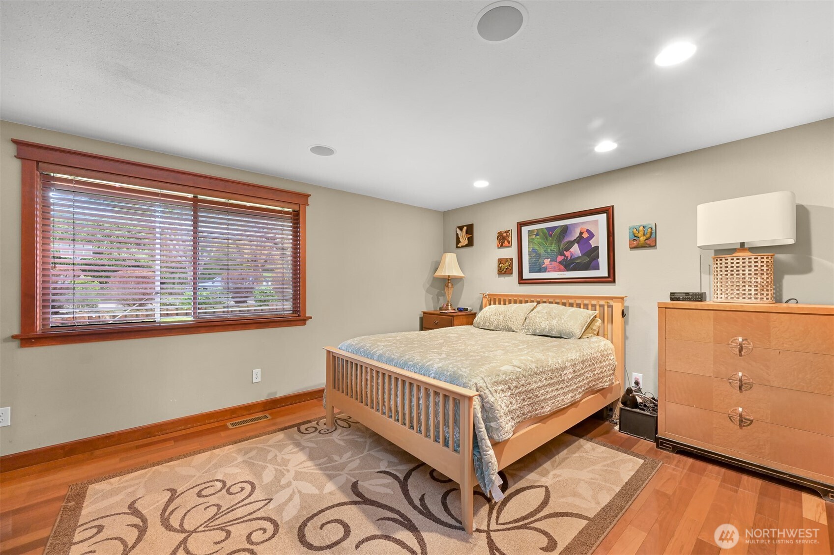 214 Bayside Place Bellingham, WA 98225 - Photo 12 of 40 a bedroom with a bed and wooden floor