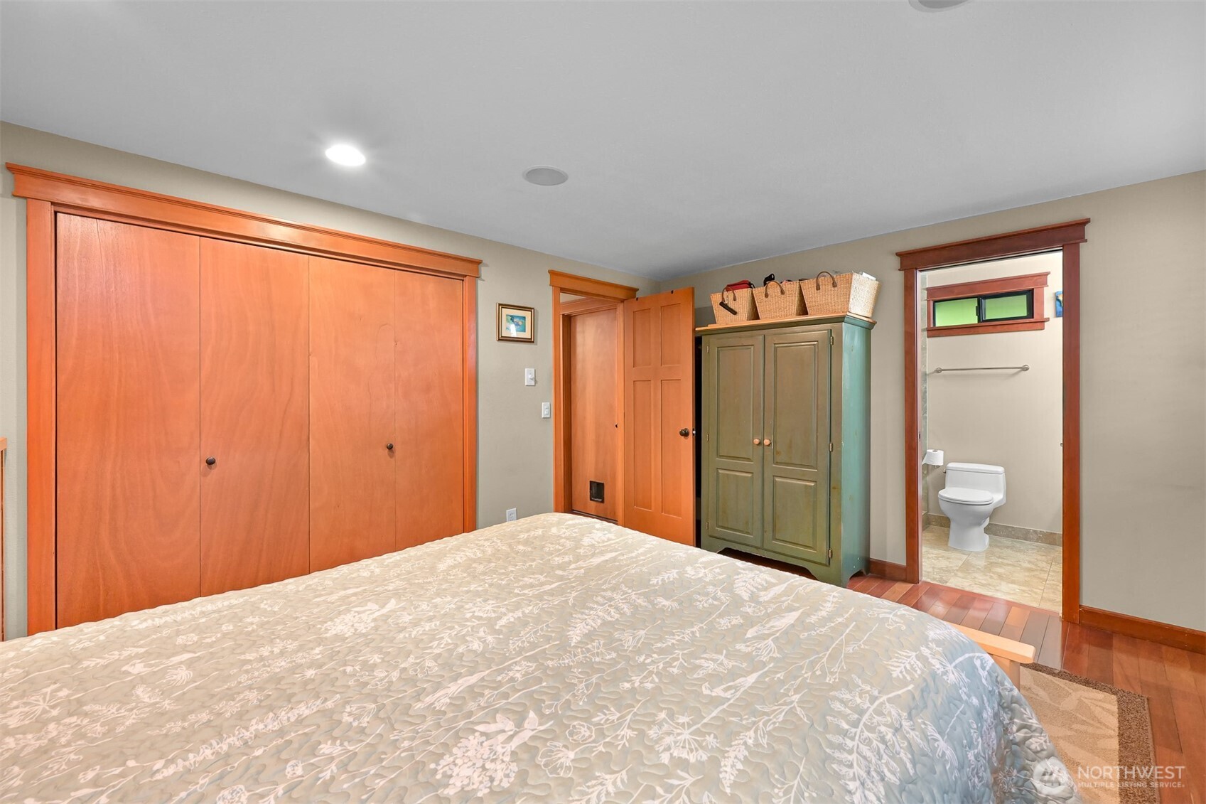 214 Bayside Place Bellingham, WA 98225 - Photo 13 of 40 a bedroom with a large bed cabinet and shower