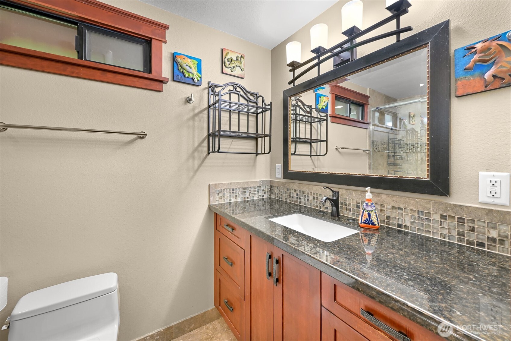 214 Bayside Place Bellingham, WA 98225 - Photo 14 of 40 a bathroom with a granite countertop sink a toilet and a mirror