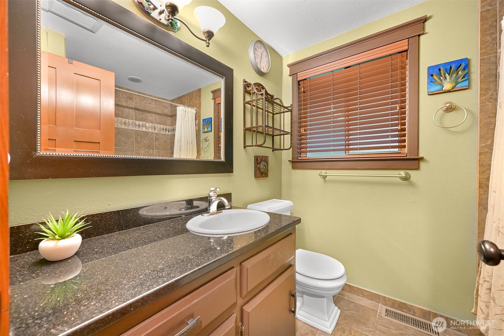 214 Bayside Place Bellingham, WA 98225 - Photo 16 of 40 a bathroom with a granite countertop sink and a mirror