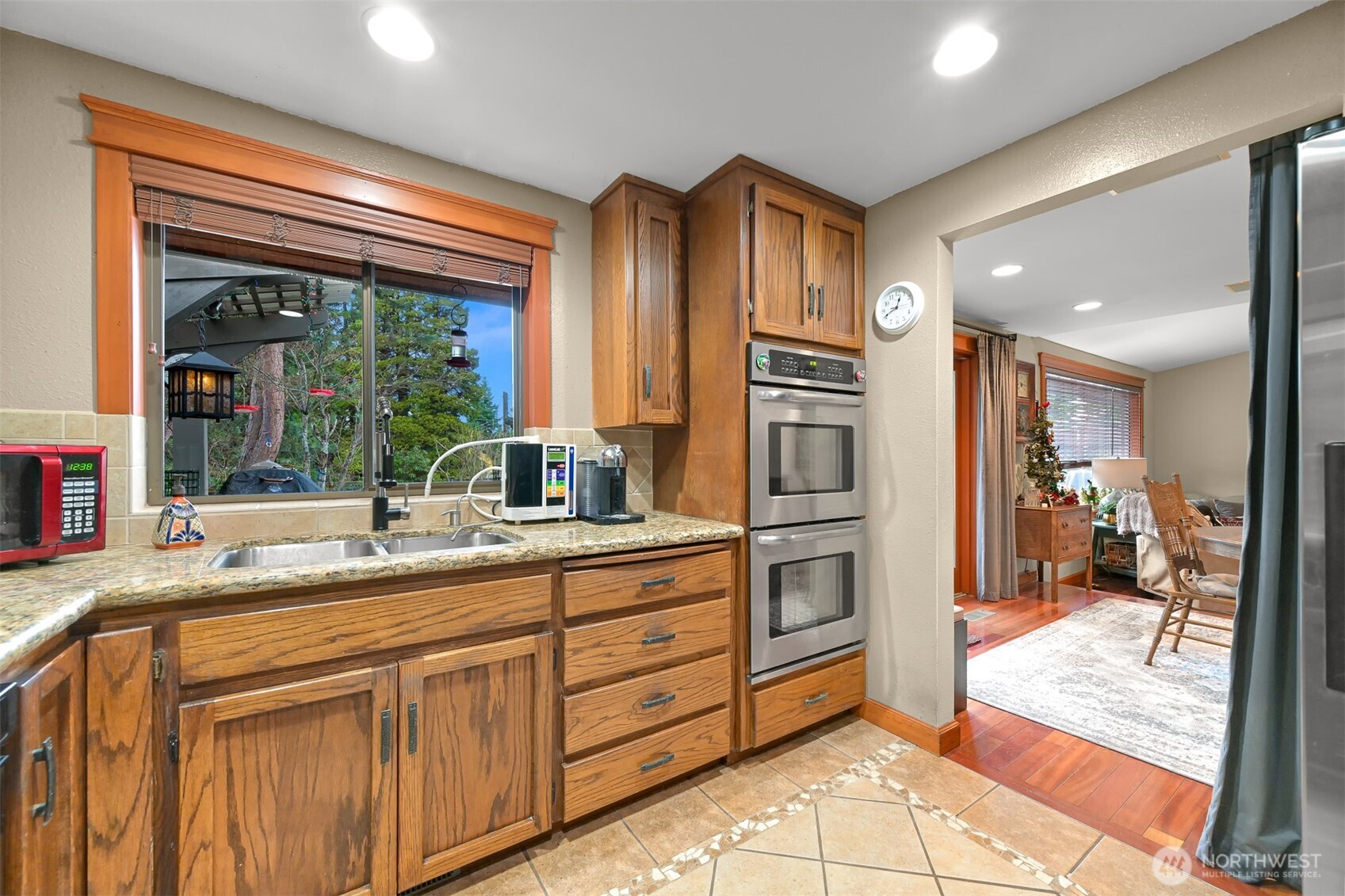 214 Bayside Place Bellingham, WA 98225 - Photo 20 of 40 a kitchen with stainless steel appliances granite countertop a refrigerator and a sink