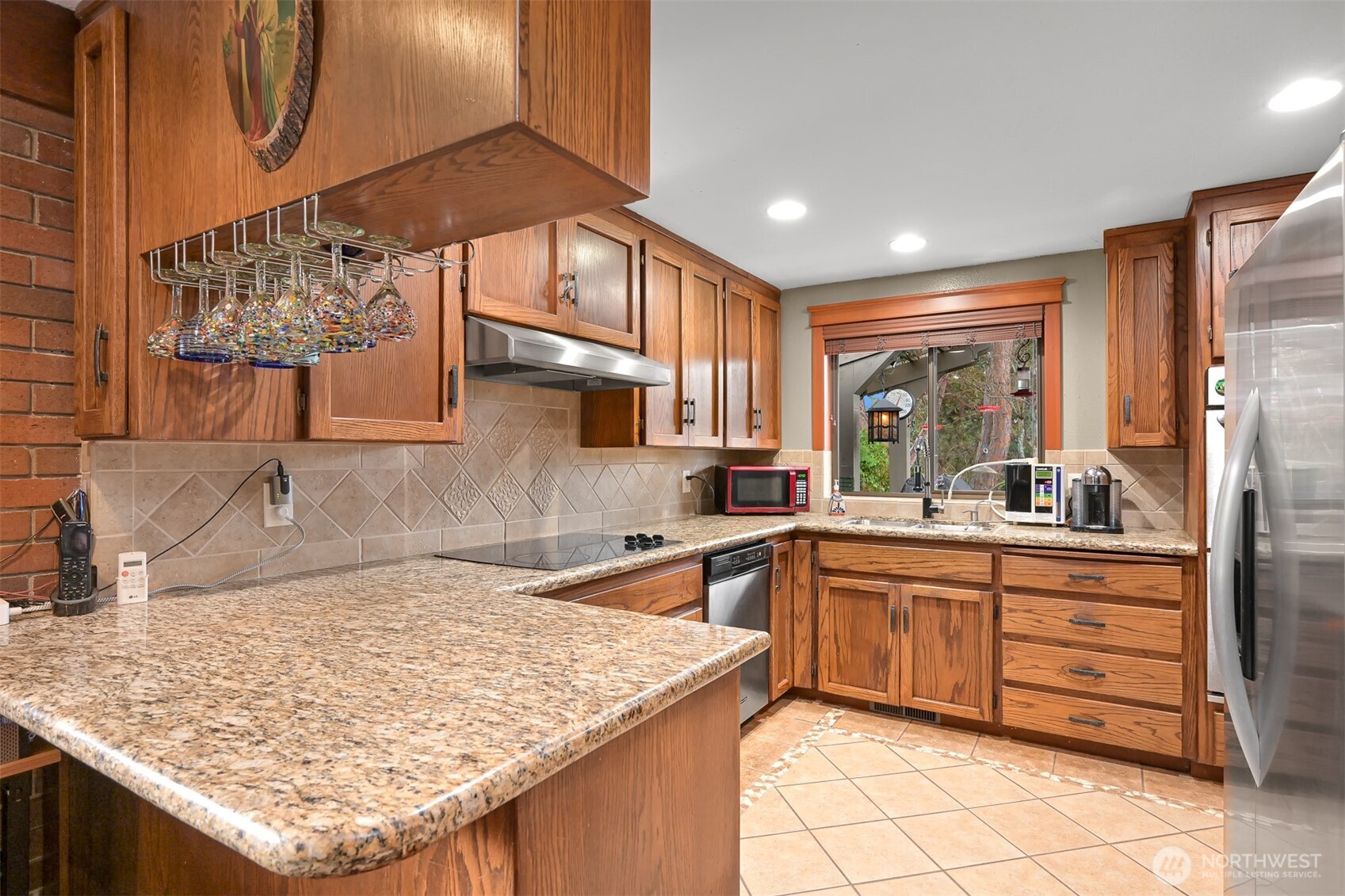 214 Bayside Place Bellingham, WA 98225 - Photo 22 of 40 a kitchen with stainless steel appliances granite countertop a sink stove and cabinets