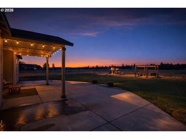 a view of a swimming pool with an outdoor seating