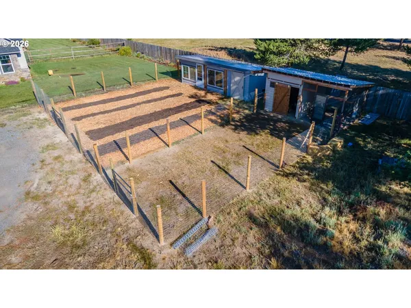 a view of a backyard with sitting area